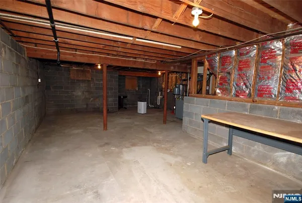a view of an empty room with wooden walls