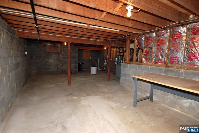 a view of an empty room with wooden walls