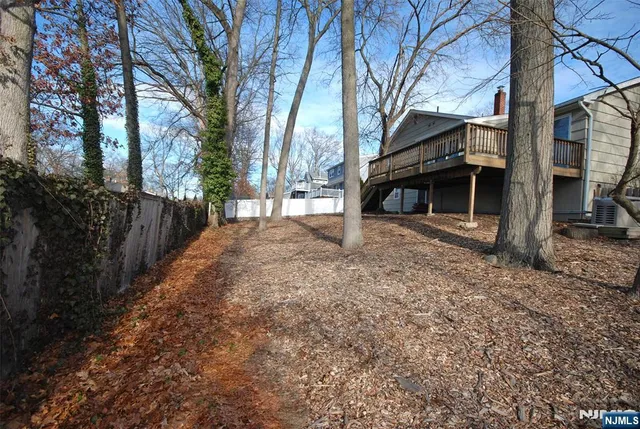 a view of a house with a yard covered in snow