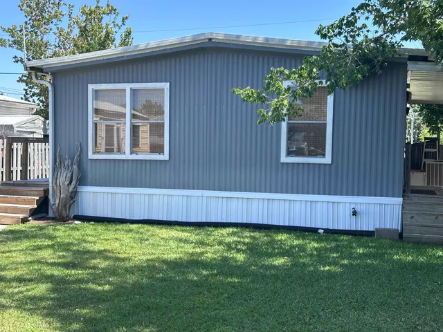 a view of balcony with wooden floor and outdoor seating