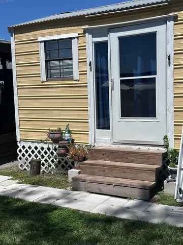 a view of livingroom with furniture and window