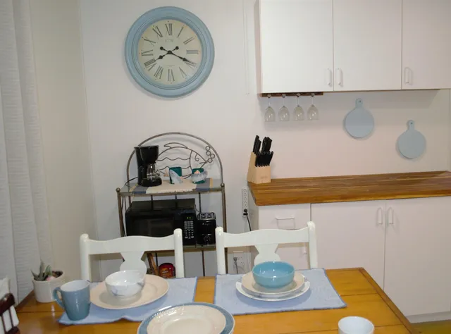 a living room with furniture and a lamps