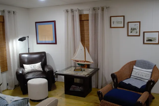 a bed sitting in a bedroom next to a lamp