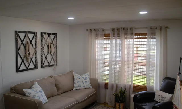 a bathroom with a toilet a sink and a mirror
