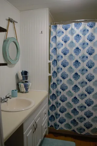 a bedroom with a bed and a television