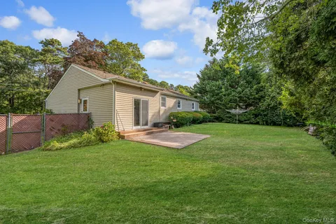 a view of a house with yard and a garden