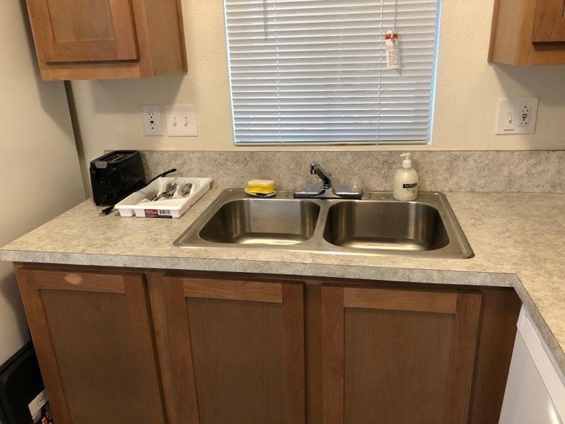 1833 Sams Lane Pollock Pines, CA 95726 - Photo 14 of 23 a kitchen with a sink and cabinets