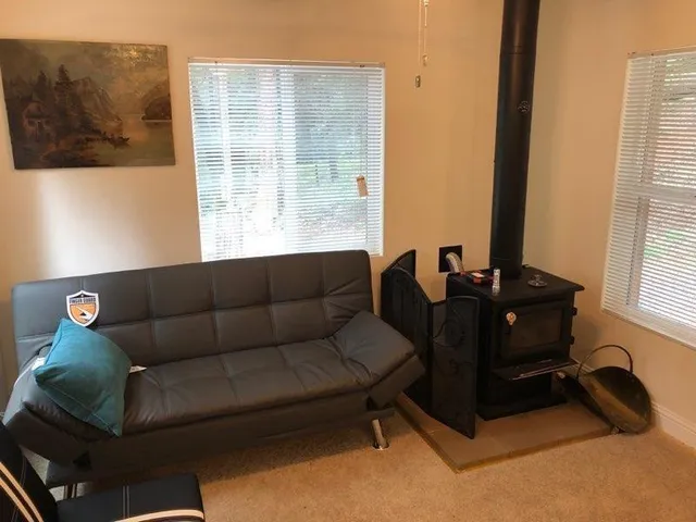 a living room with furniture and a window