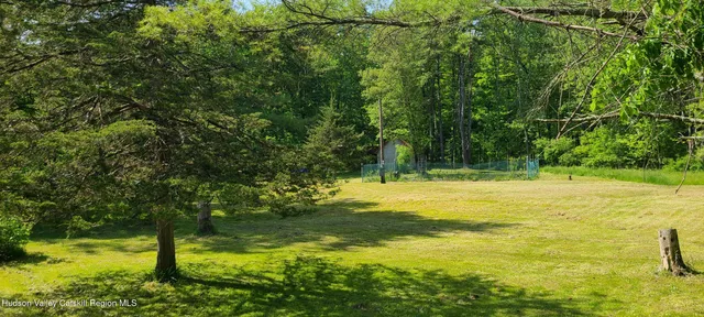 a view of a pool with a yard