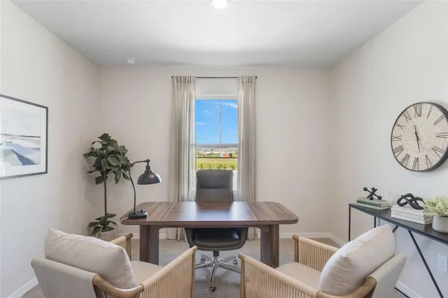 a view of a livingroom with furniture and window