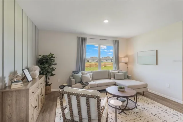 a living room with furniture and a window
