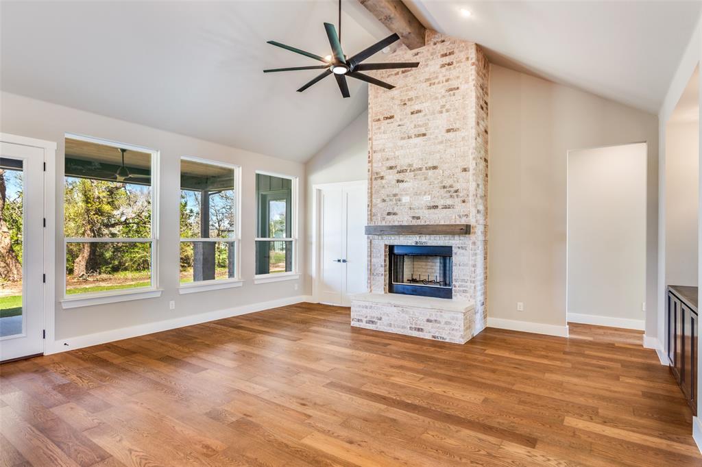 555 Aermotor Loop Weatherford, TX 76085 - Photo 7 of 30 a view of an empty room with a fireplace and a window