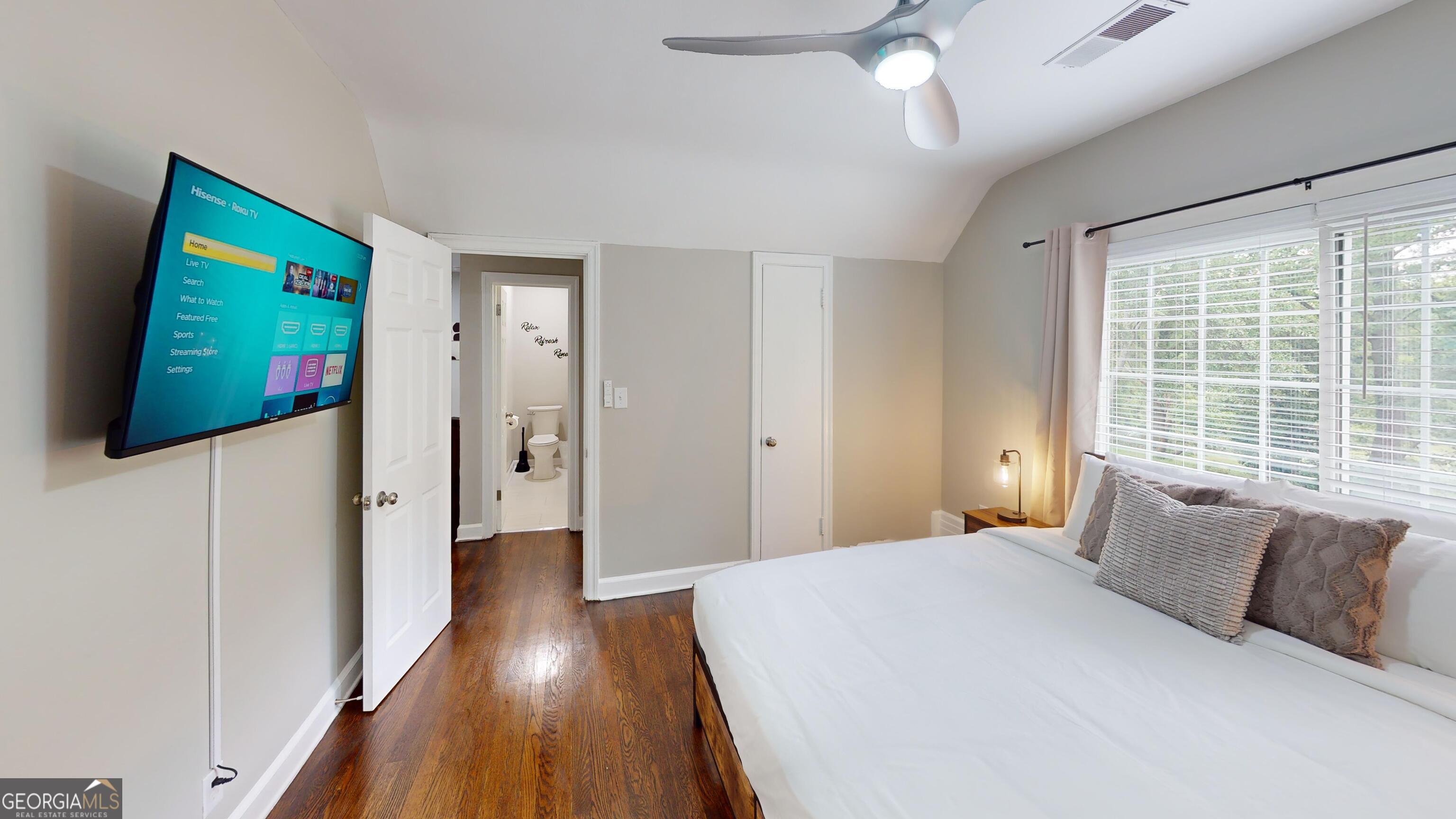 1114 Fayetteville Road Southeast Atlanta, GA 30316 - Photo 11 of 28 a bedroom with a bed and a flat screen tv