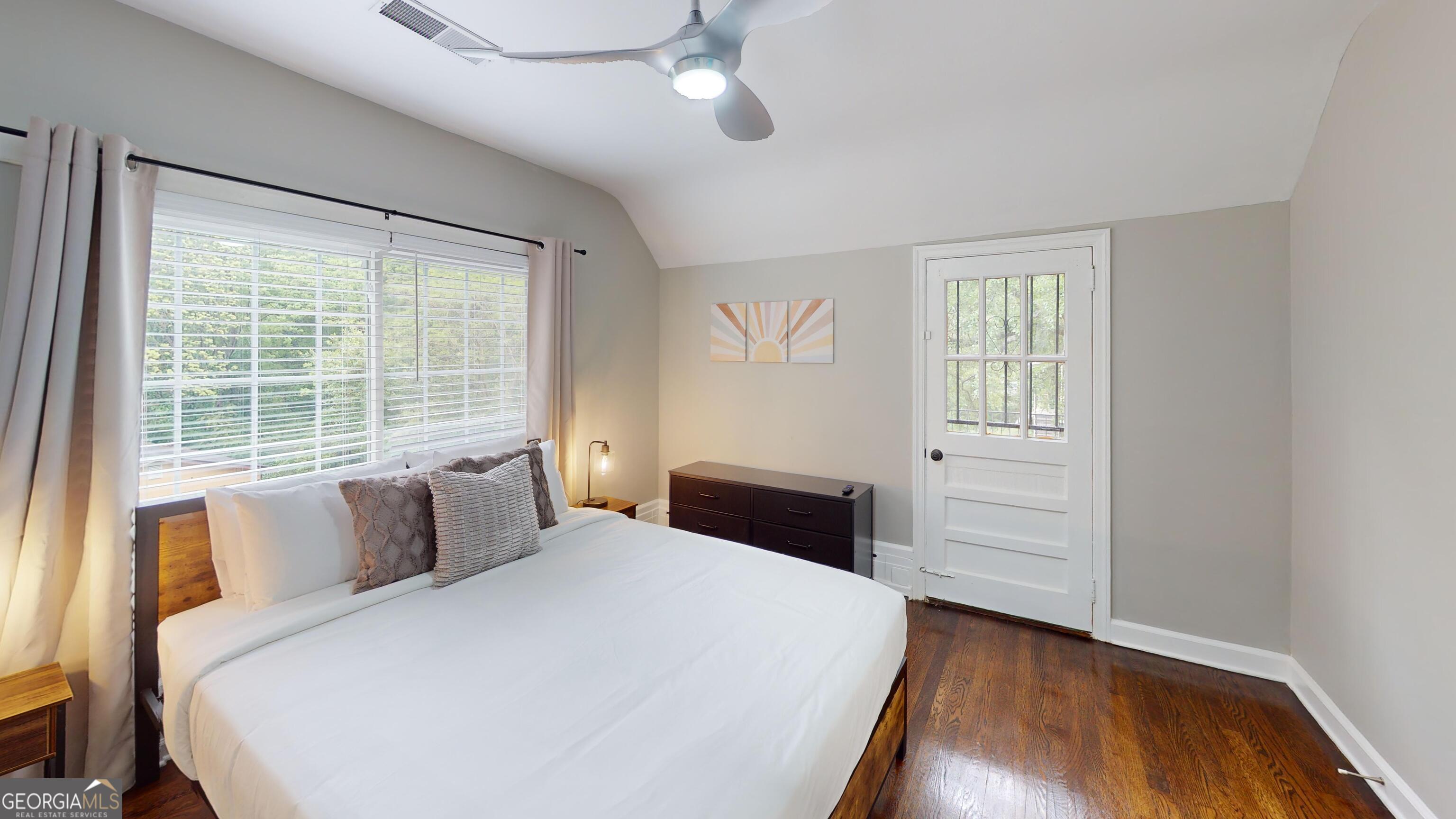 1114 Fayetteville Road Southeast Atlanta, GA 30316 - Photo 12 of 28 a bedroom with a bed and wooden floor