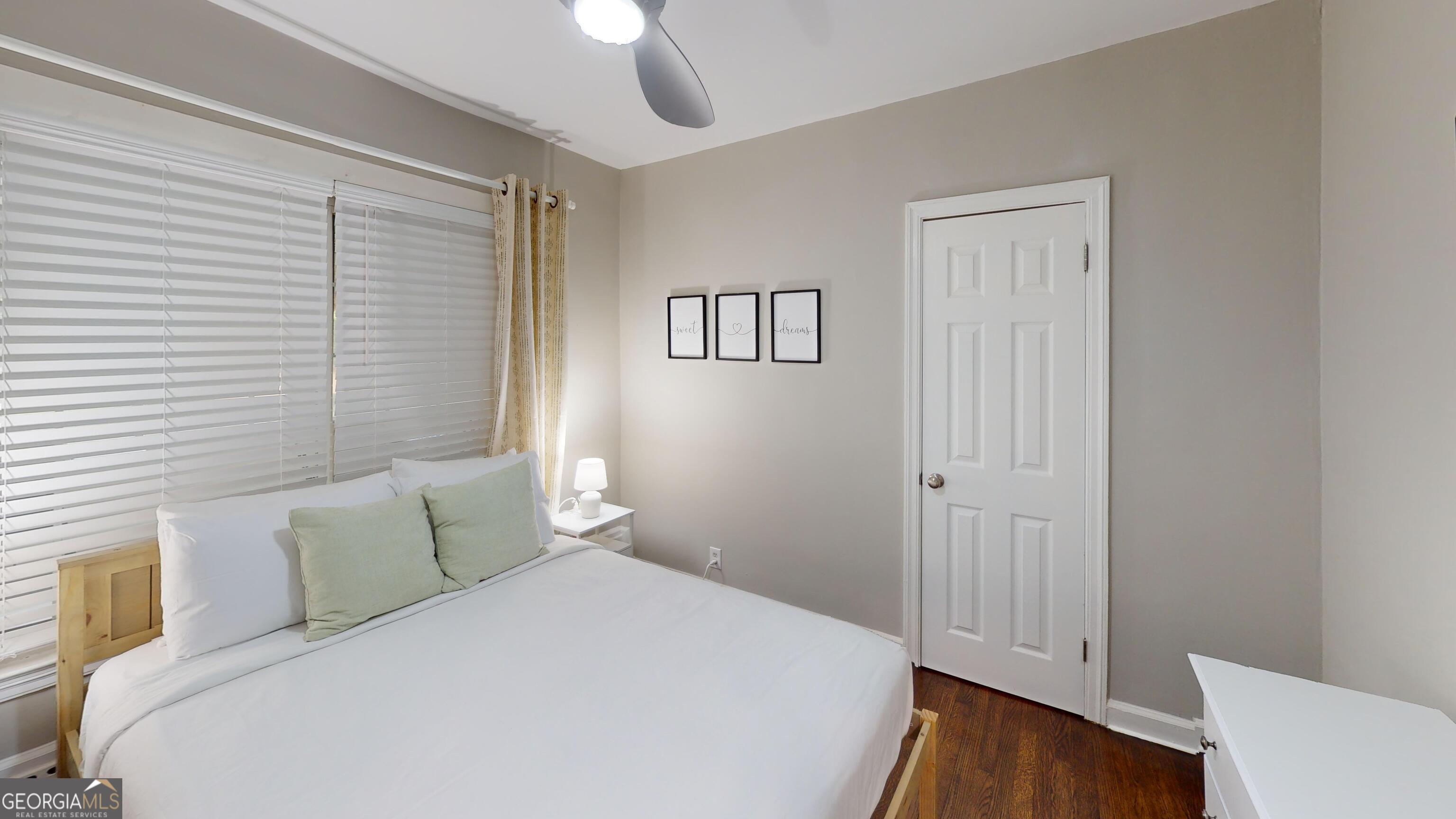 1114 Fayetteville Road Southeast Atlanta, GA 30316 - Photo 14 of 28 a bedroom with a bed and a window