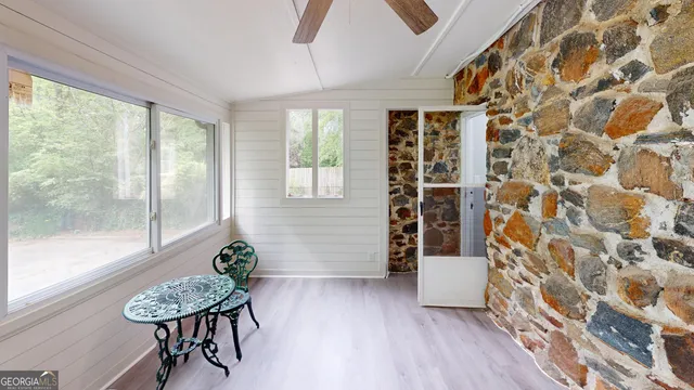a view of a room with furniture and a potted plant