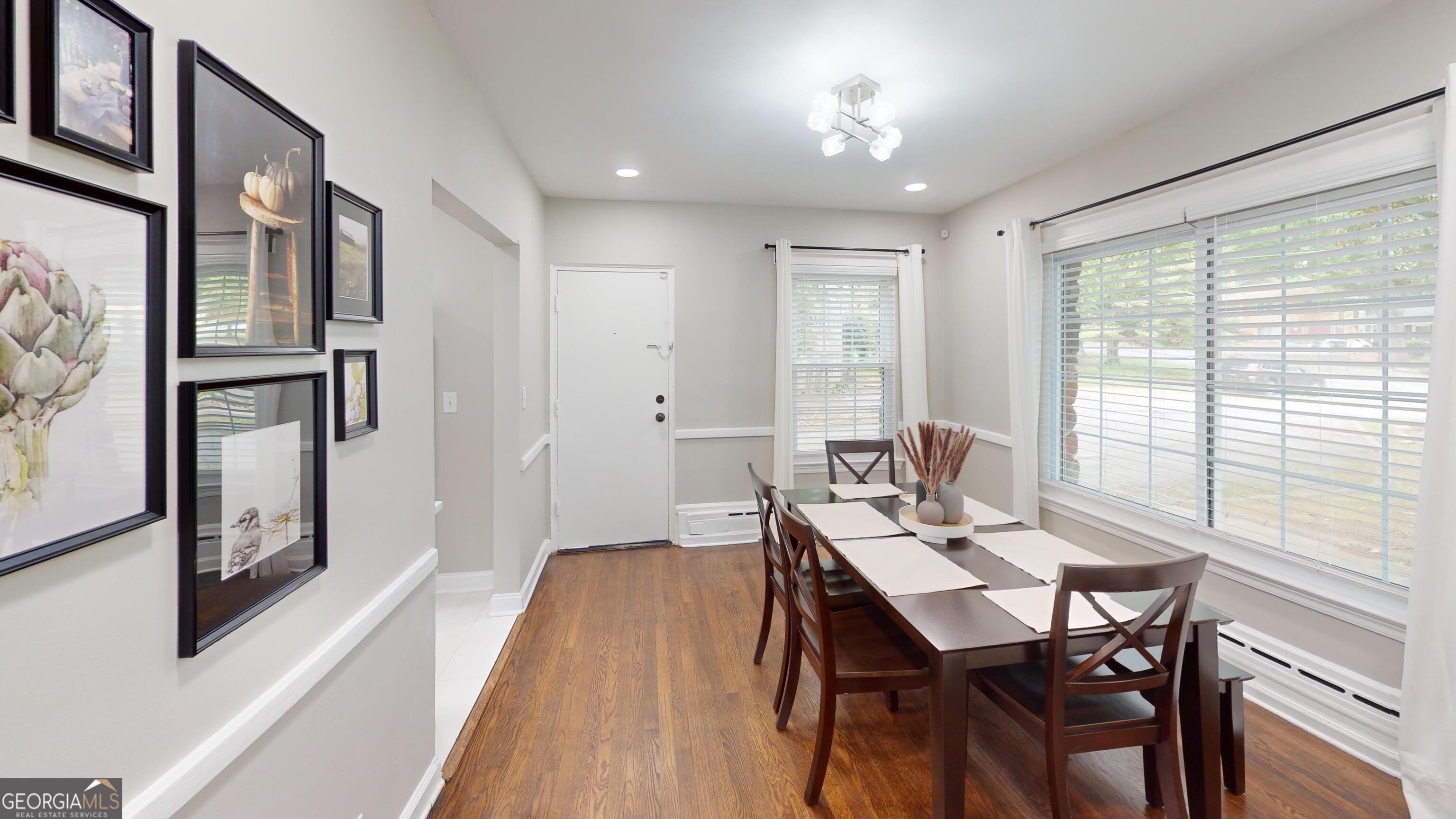 1114 Fayetteville Road Southeast Atlanta, GA 30316 - Photo 3 of 28 a view of a dining room with furniture window and wooden floor
