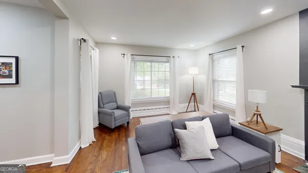 a living room with furniture and a window