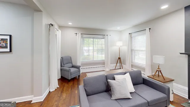 a living room with furniture and a window