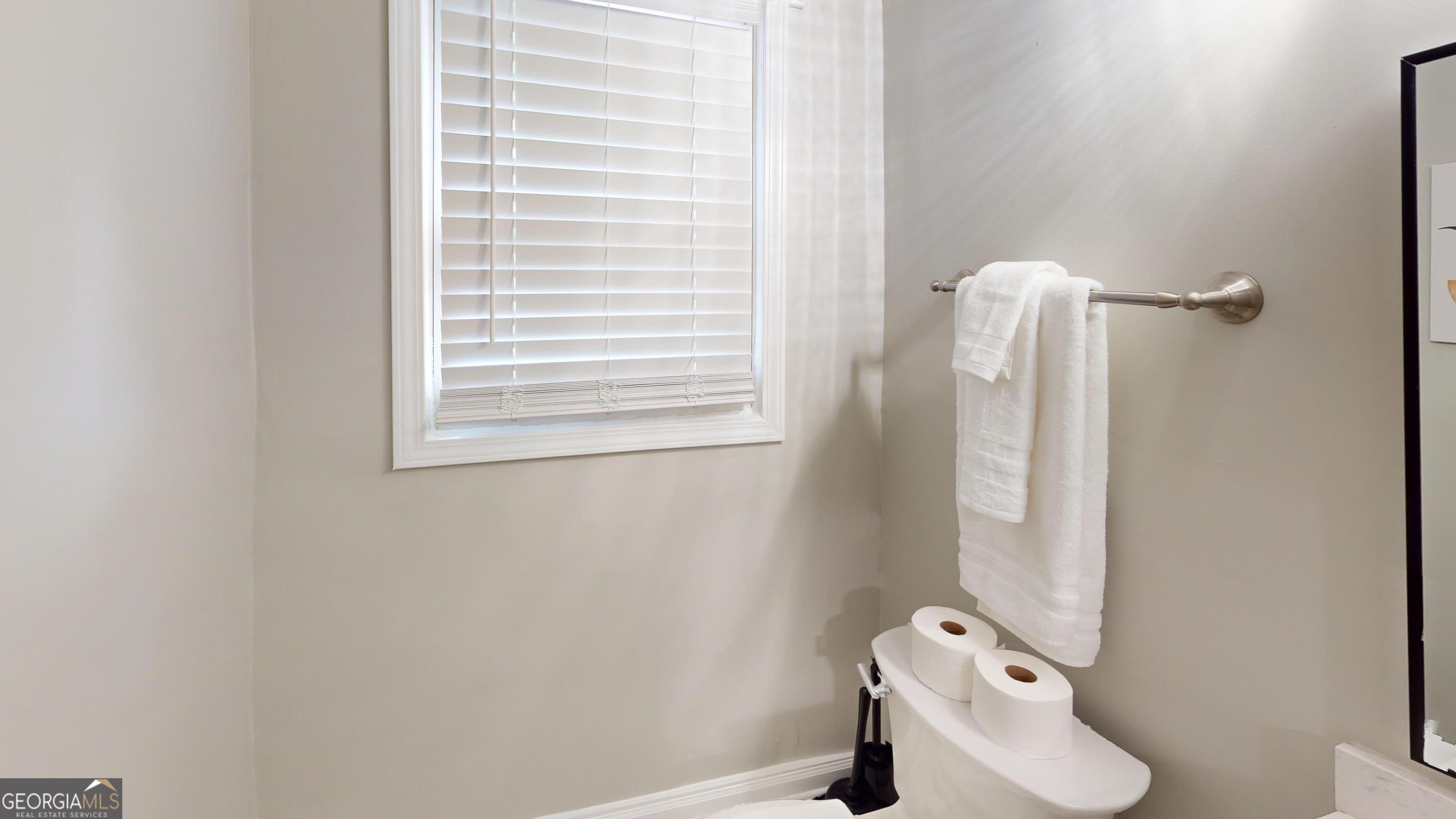 1114 Fayetteville Road Southeast Atlanta, GA 30316 - Photo 6 of 28 a bathroom with a toilet and a shower