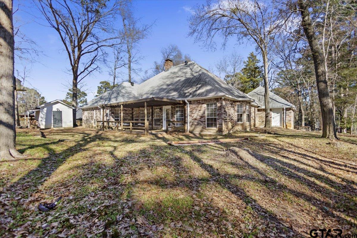 1336 Bridle Path Lane Hideaway, TX 75771 - Photo 12 of 48 a front view of a house with a yard