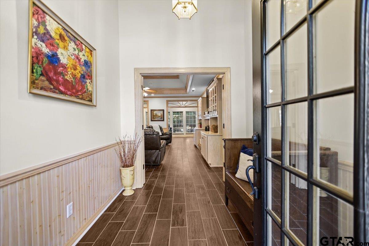 1336 Bridle Path Lane Hideaway, TX 75771 - Photo 16 of 48 a view of a hallway with wooden floor and staircase
