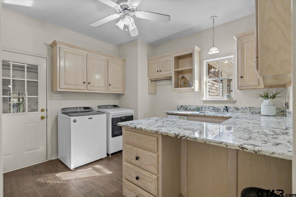 1336 Bridle Path Lane Hideaway, TX 75771 - Photo 33 of 48 a kitchen with a stove a sink and a refrigerator