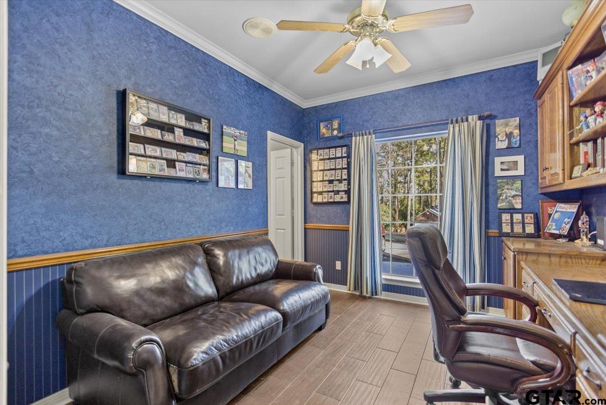 1336 Bridle Path Lane Hideaway, TX 75771 - Photo 41 of 48 a living room with furniture a flat screen tv and a large window