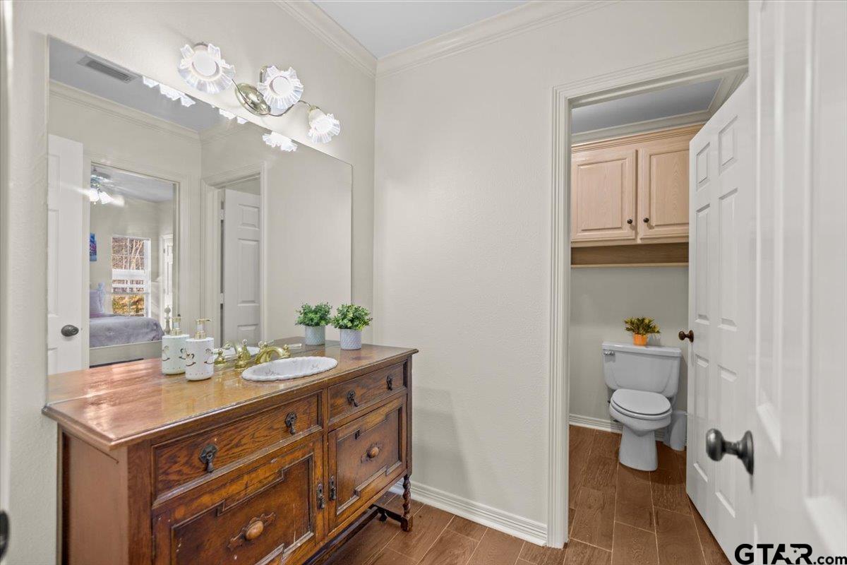 1336 Bridle Path Lane Hideaway, TX 75771 - Photo 7 of 48 a bathroom with a double vanity sink and a toilet