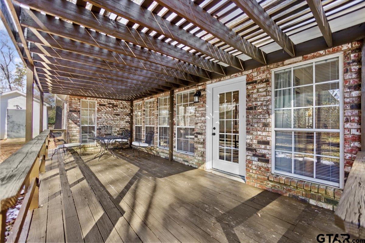 1336 Bridle Path Lane Hideaway, TX 75771 - Photo 9 of 48 a view of an empty room with wooden floor
