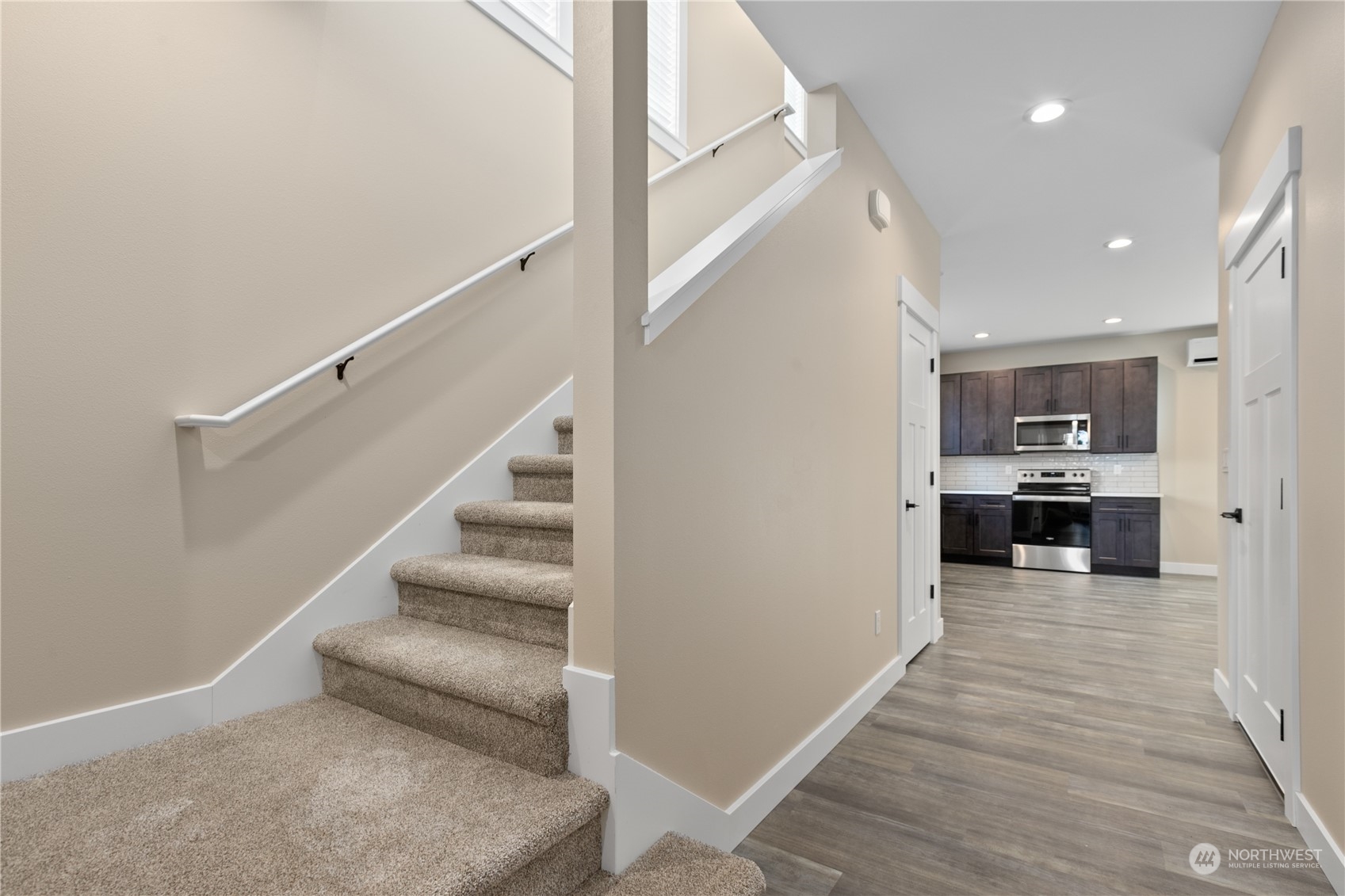 2217 Dejong Drive Lynden, WA 98264 - Photo 14 of 28 a view of a kitchen with kitchen island wooden floor and electronic appliances