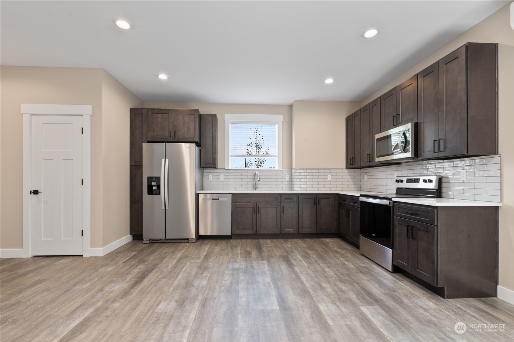 2217 Dejong Drive Lynden, WA 98264 - Photo 17 of 28 a kitchen with stainless steel appliances a refrigerator and a stove top oven