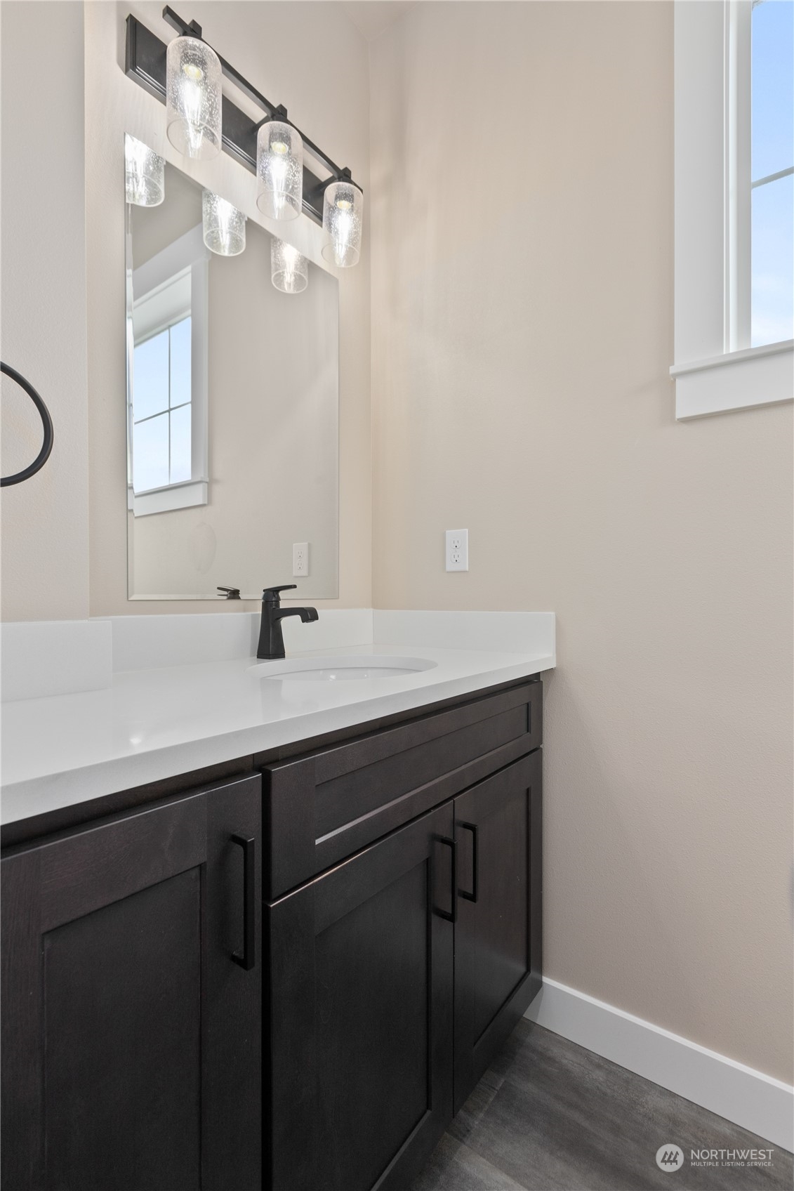 2217 Dejong Drive Lynden, WA 98264 - Photo 19 of 28 a sink with a mirror and vanity
