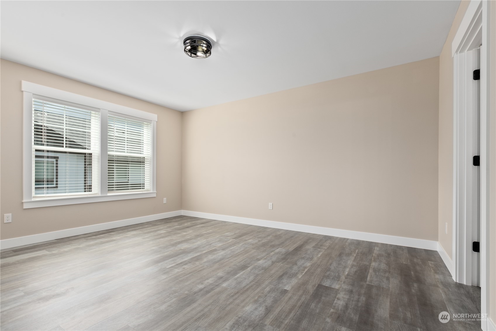 2217 Dejong Drive Lynden, WA 98264 - Photo 20 of 28 a view of an empty room with wooden floor and a window