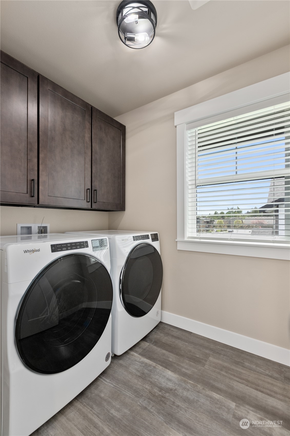 2217 Dejong Drive Lynden, WA 98264 - Photo 22 of 28 a utility room with wooden floor and cabinets
