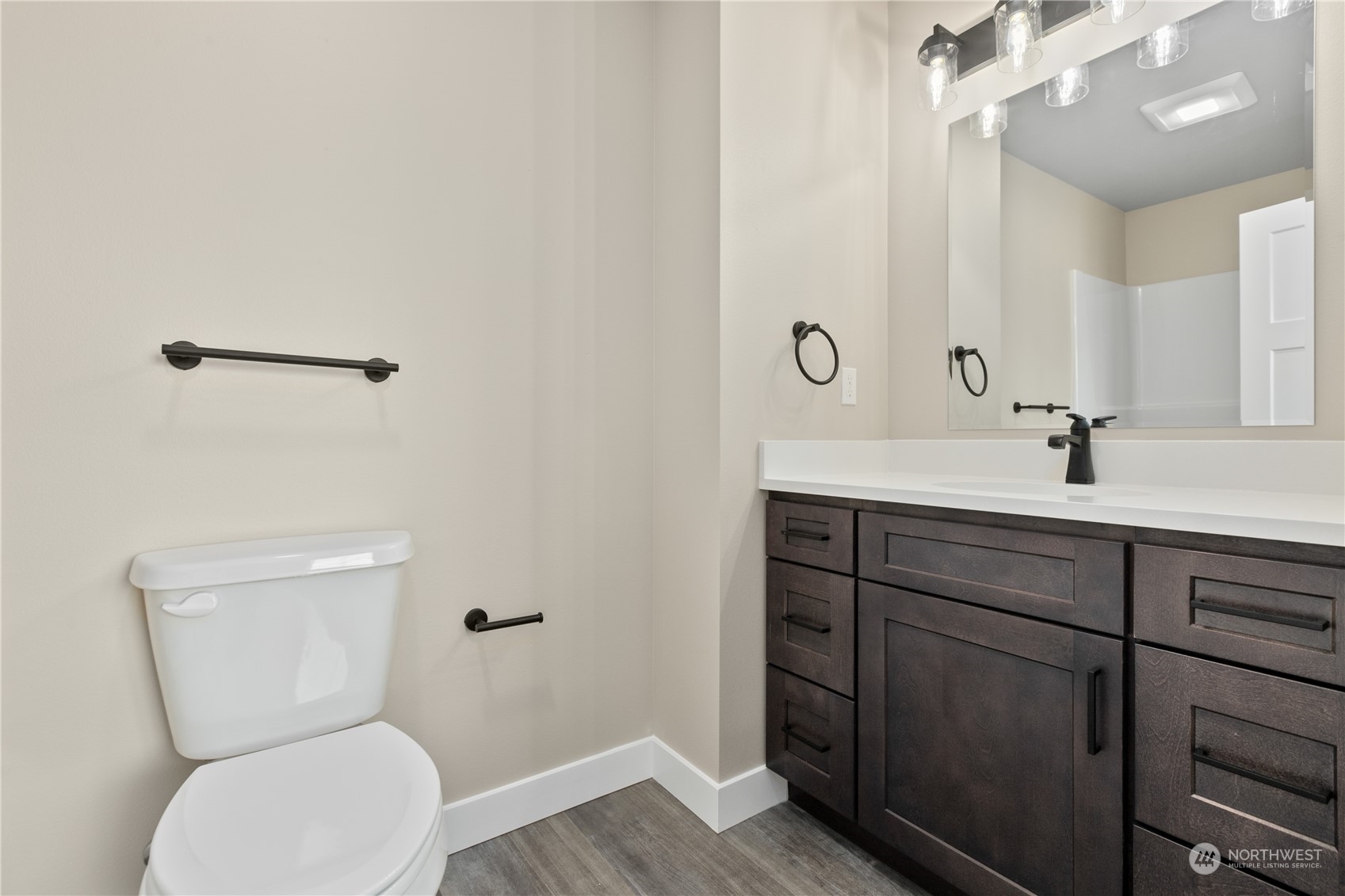 2217 Dejong Drive Lynden, WA 98264 - Photo 23 of 28 a bathroom with a toilet sink and mirror