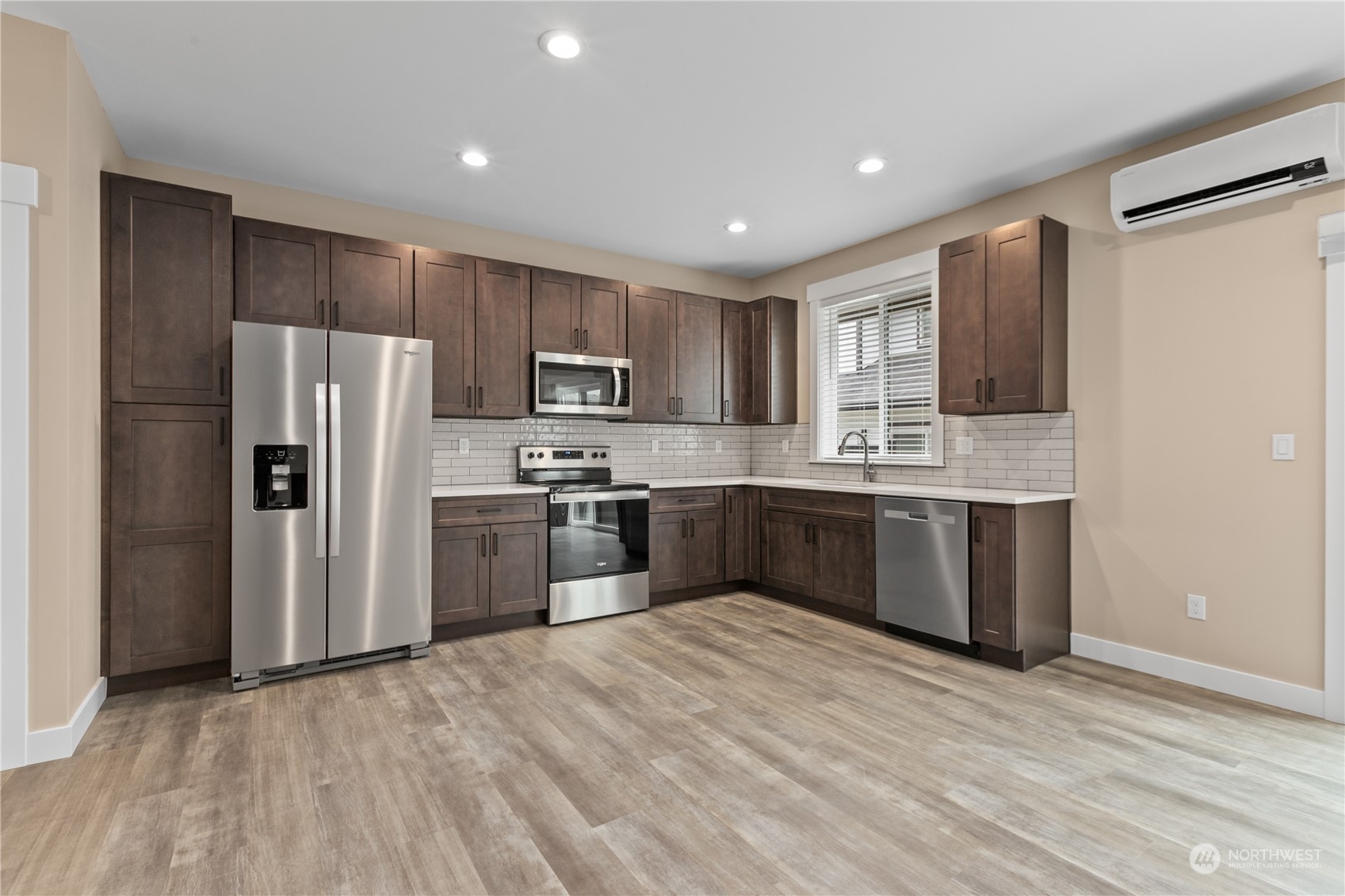 2217 Dejong Drive Lynden, WA 98264 - Photo 26 of 28 a kitchen with refrigerator cabinets and wooden floor