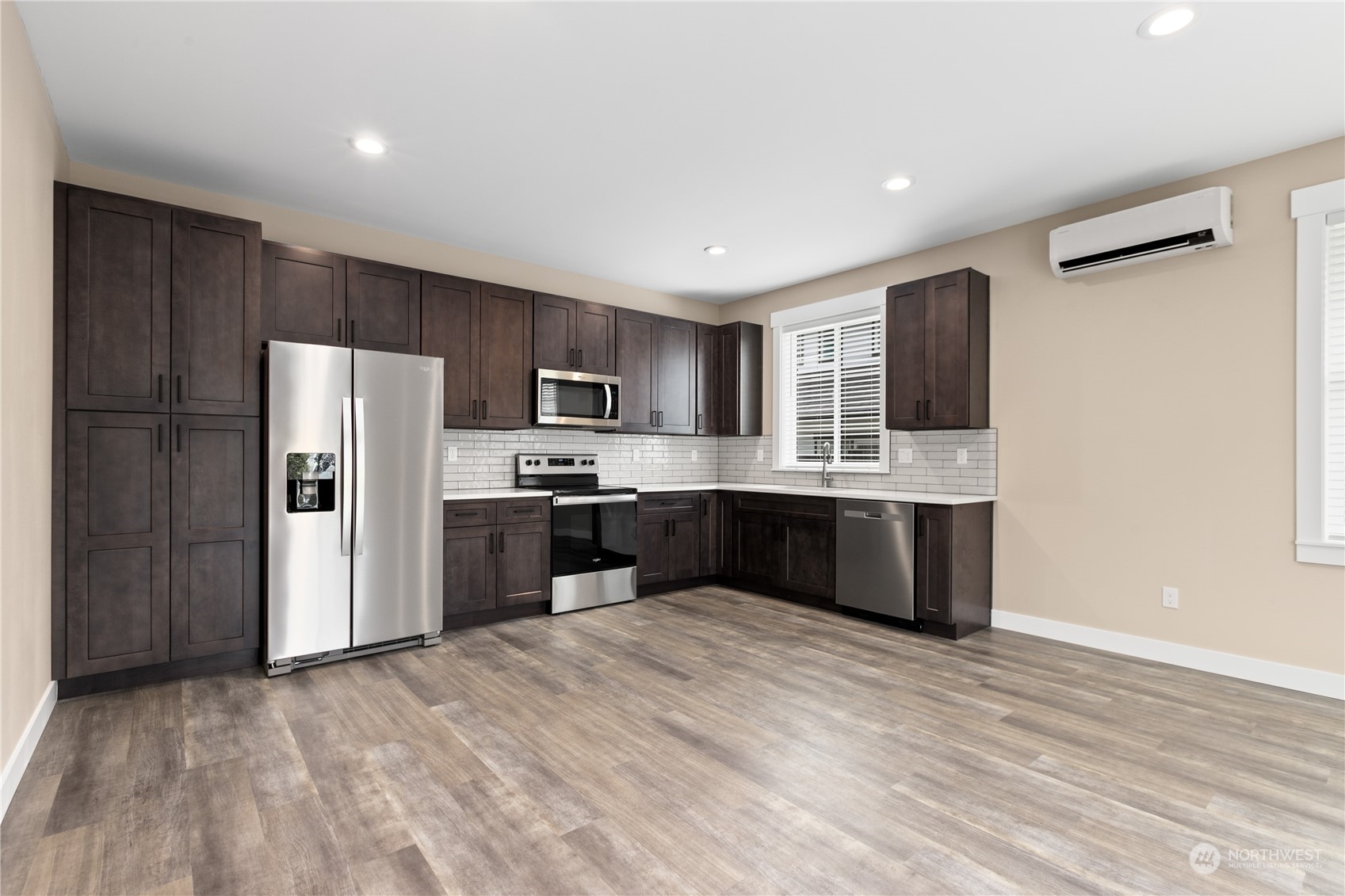 2217 Dejong Drive Lynden, WA 98264 - Photo 27 of 28 a large kitchen with a refrigerator and a stove top oven