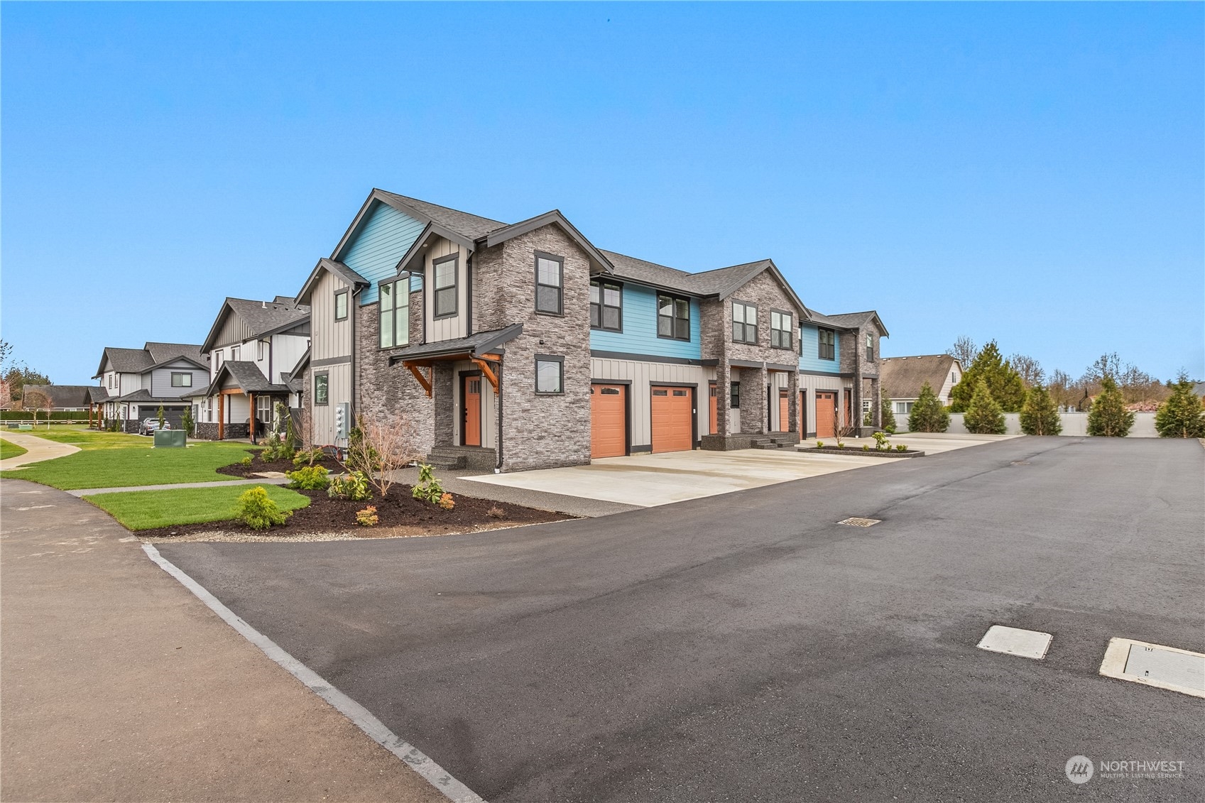 2217 Dejong Drive Lynden, WA 98264 - Photo 4 of 28 a front view of a house with a garden and parking