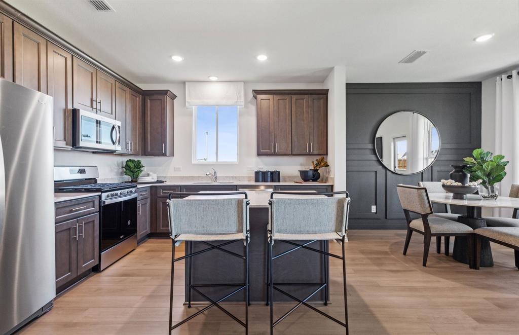 1136 Loch Way Princeton, TX 75407 - Photo 3 of 17 Spacious kitchen with eat-in bartop island *model representation