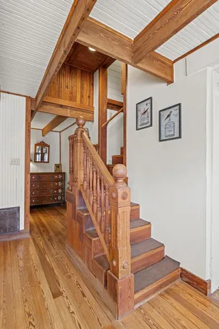 a bathroom with a toilet a sink and a window