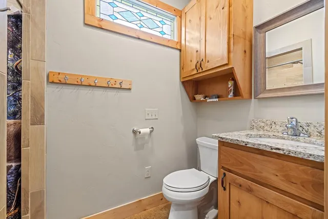 a dining area with stainless steel appliances kitchen island granite countertop a dining table and chairs