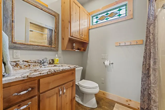 a view of a house with a yard and tree s