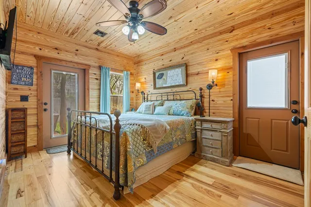 a view of a house with backyard sitting area and garden