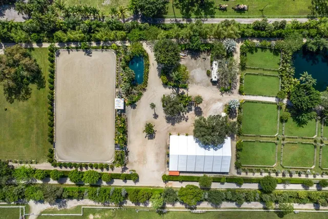 an aerial view of a house with a lake view