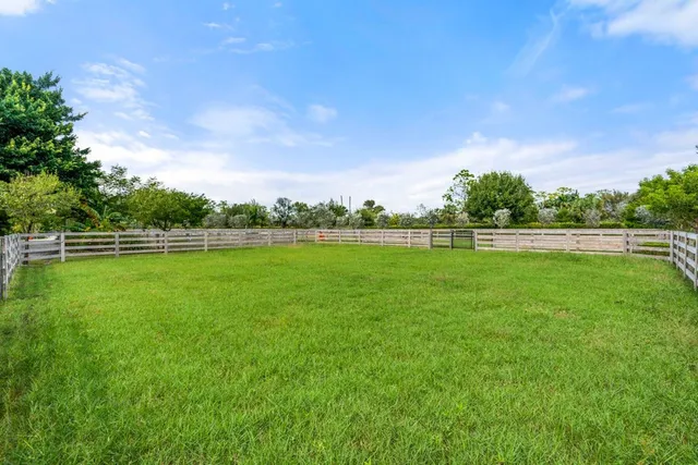 a view of outdoor space with deck and yard