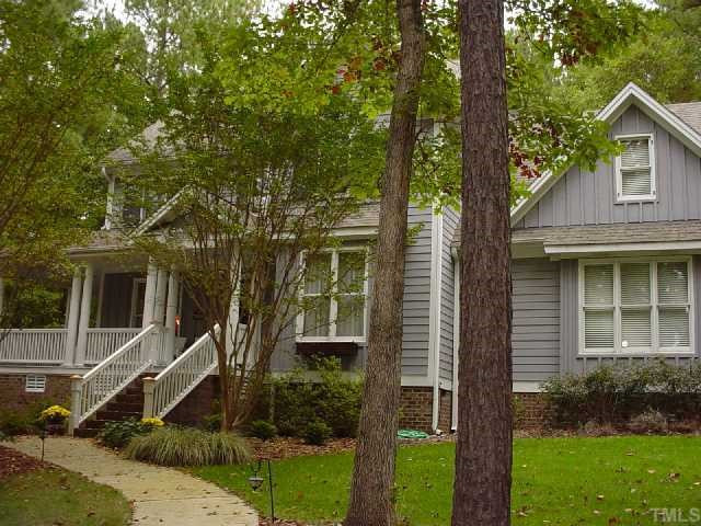 From the moment you walk up to this home you will be impressed with its inviting charm. The wraparound porch beckons you to sit and stay a while. The quality is evident right from the front door with its beautiful hardware and whimsical "bear" knocker. Exterior Front