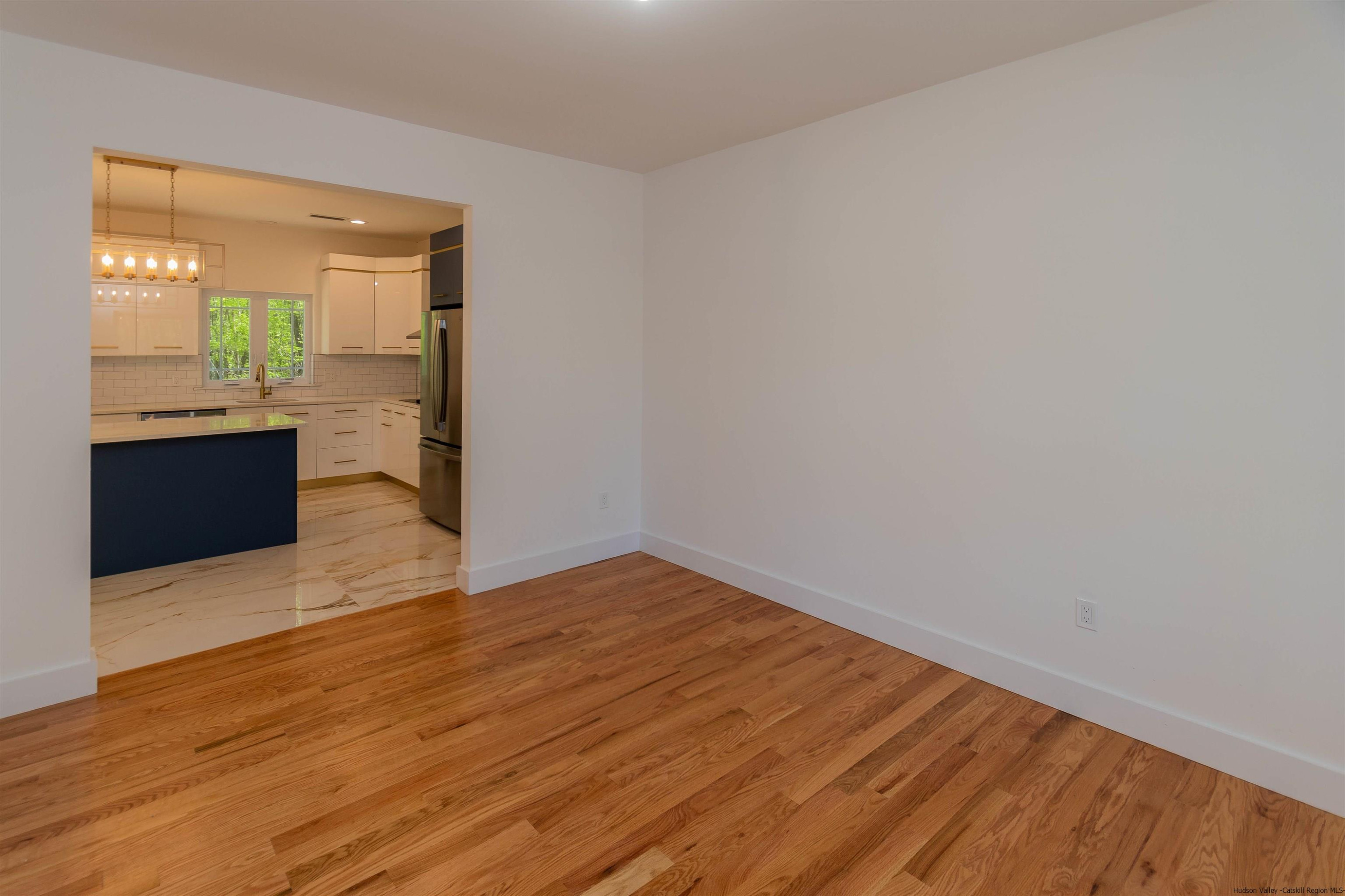 5 Calico Ways Ways, Unit WAYS Wallkill, NY 12589 - Photo 13 of 35 a view of empty room with wooden floor and a window