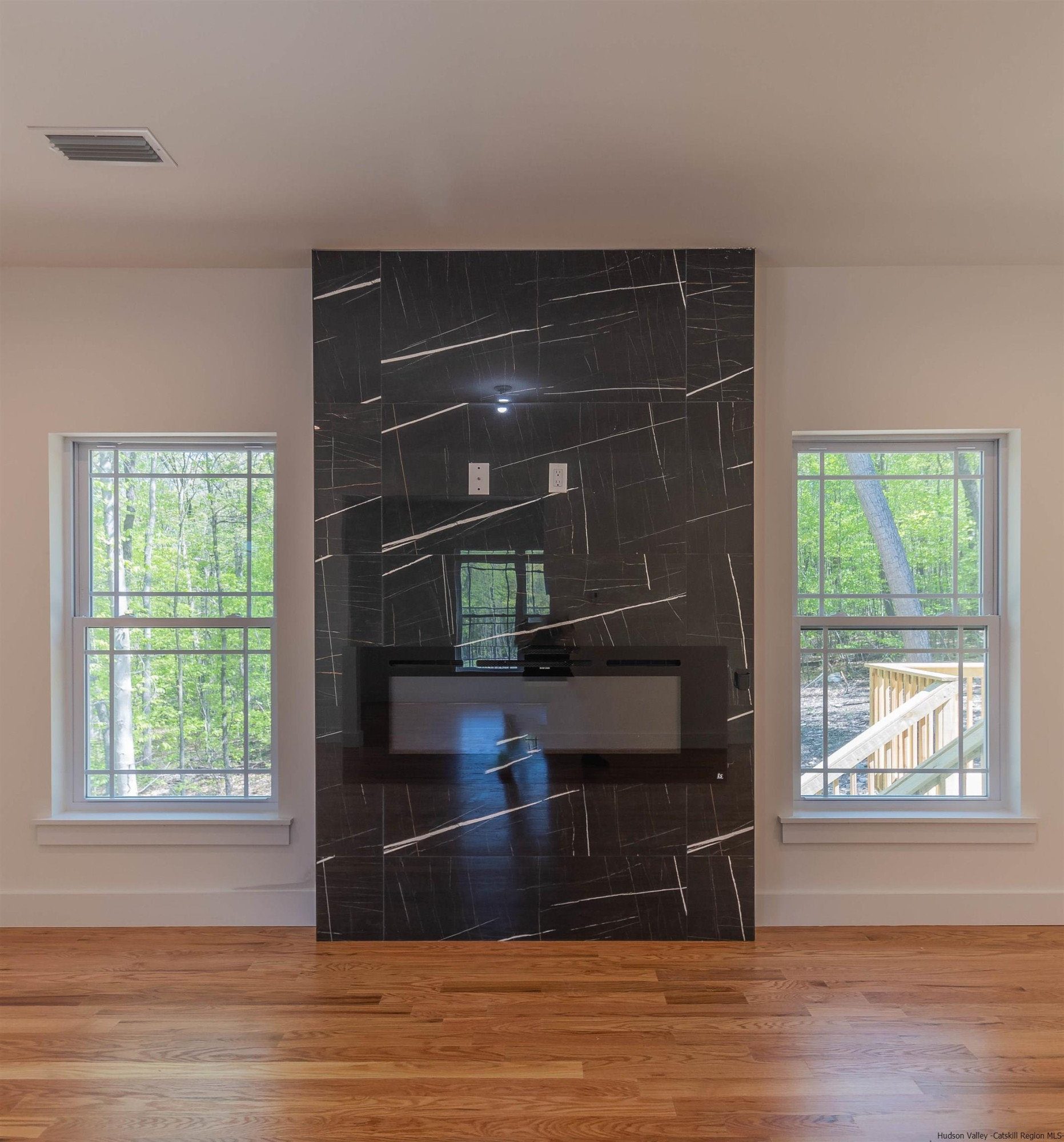 5 Calico Ways Ways, Unit WAYS Wallkill, NY 12589 - Photo 14 of 35 a room with wooden floor and a window