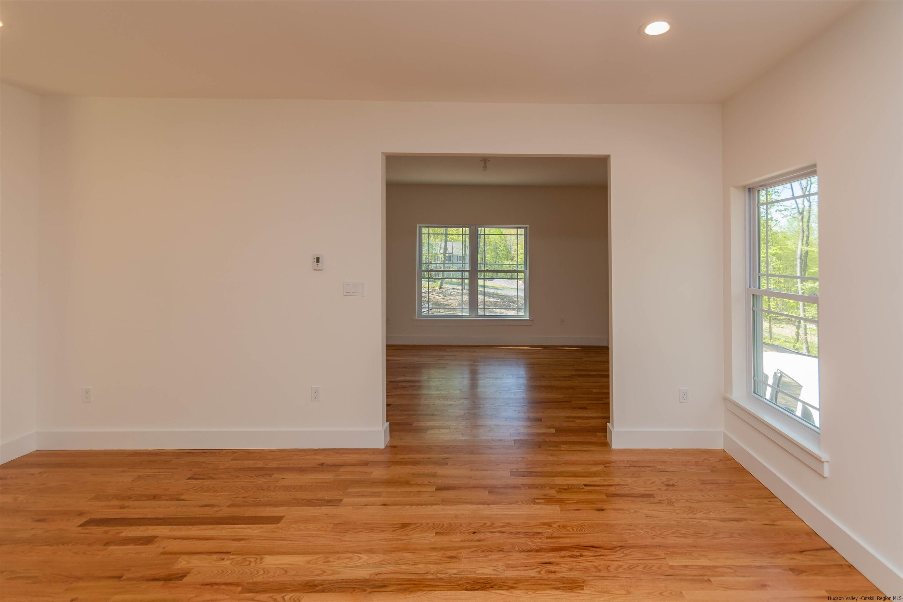 5 Calico Ways Ways, Unit WAYS Wallkill, NY 12589 - Photo 18 of 35 a view of empty room with window and wooden floor